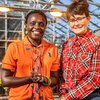 Esther Ngumbi and Erinn Dady in greenhouse