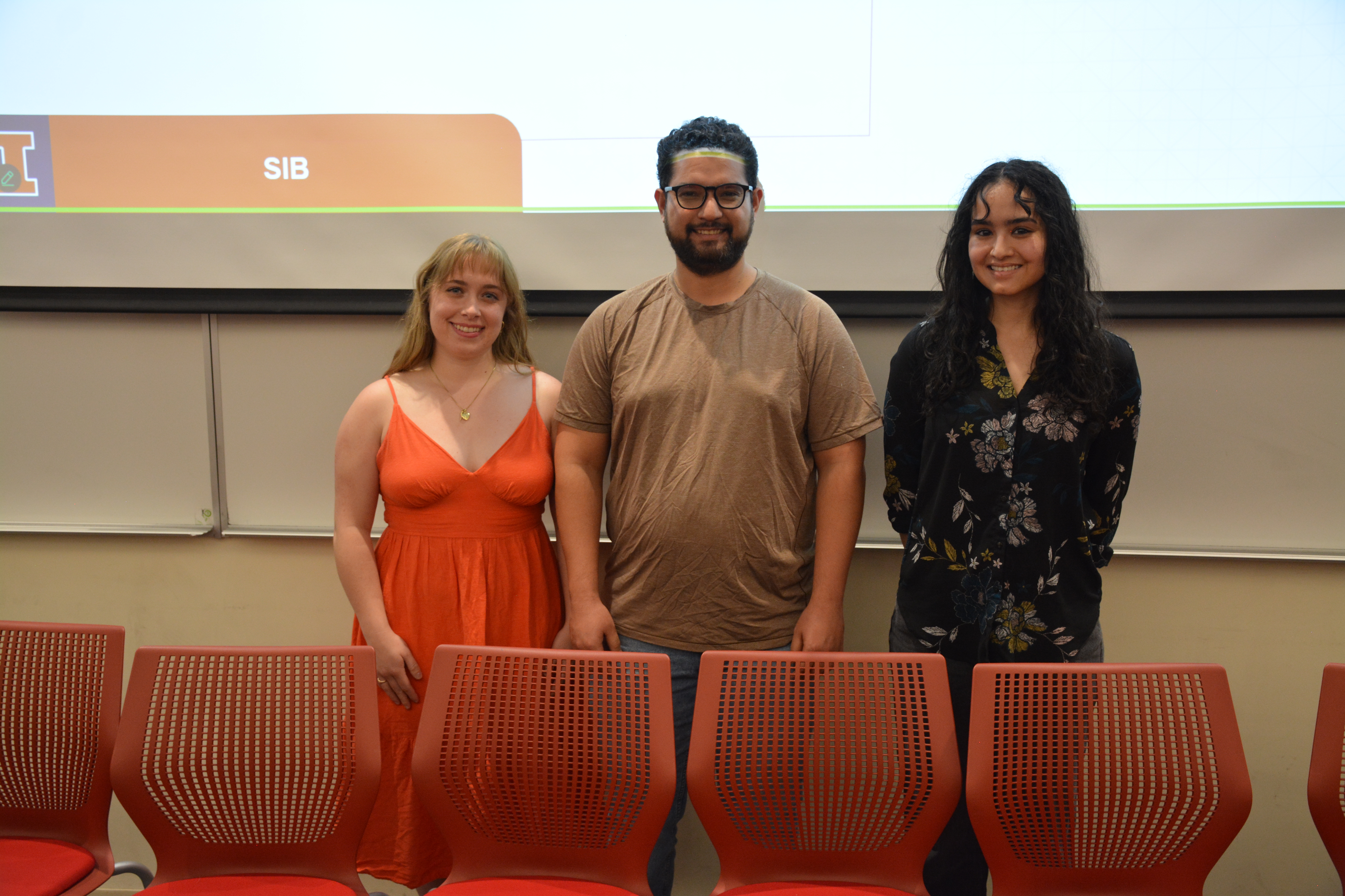 a photo of three students posing for a photo