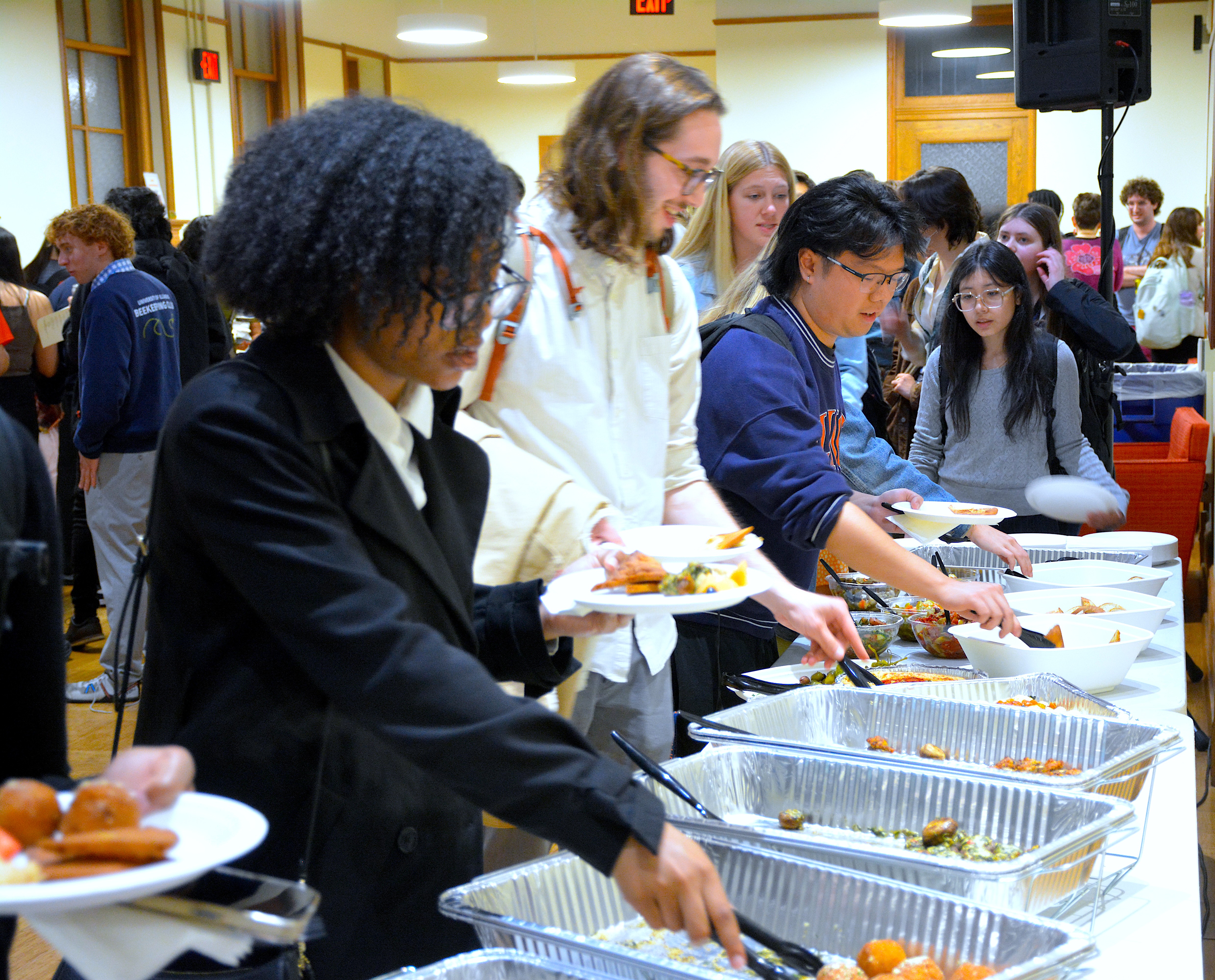 People in line getting food