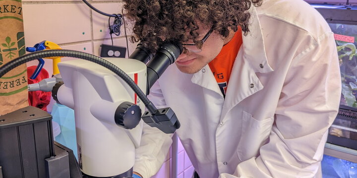 student in a lab coat