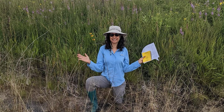A photo of a person in a field