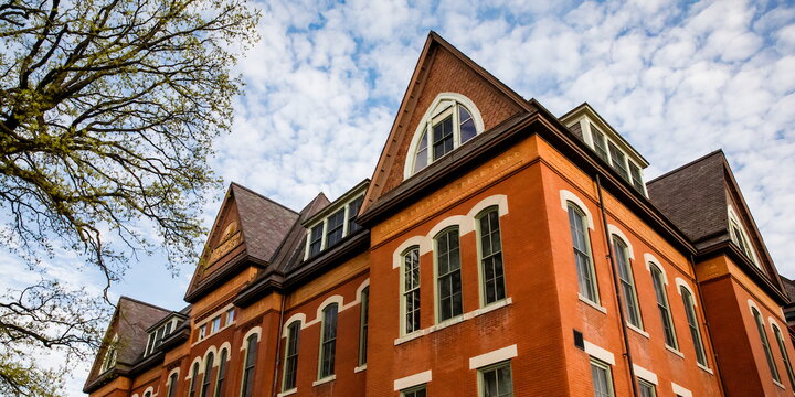 an orange building with a blue sky in the background