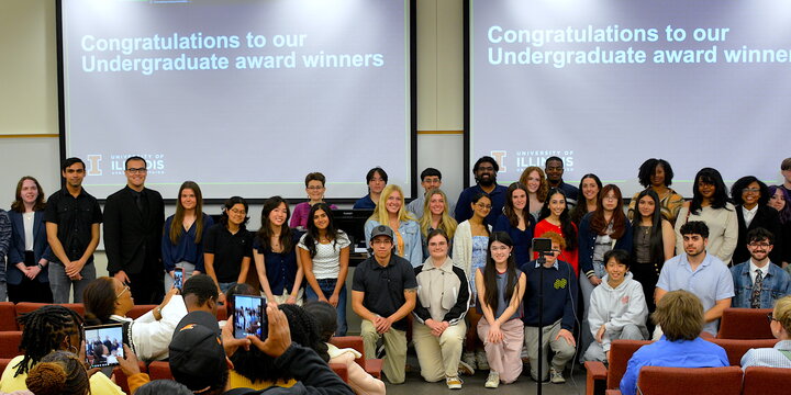 auditorium with undergraduate award winners lined up in the front 