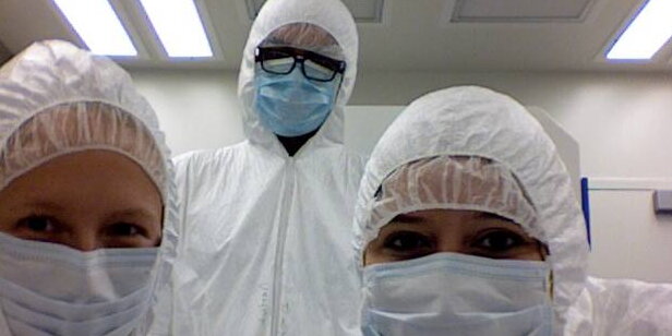 People in masks and protective plastic gear