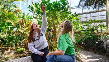 students chatting in the conservatory