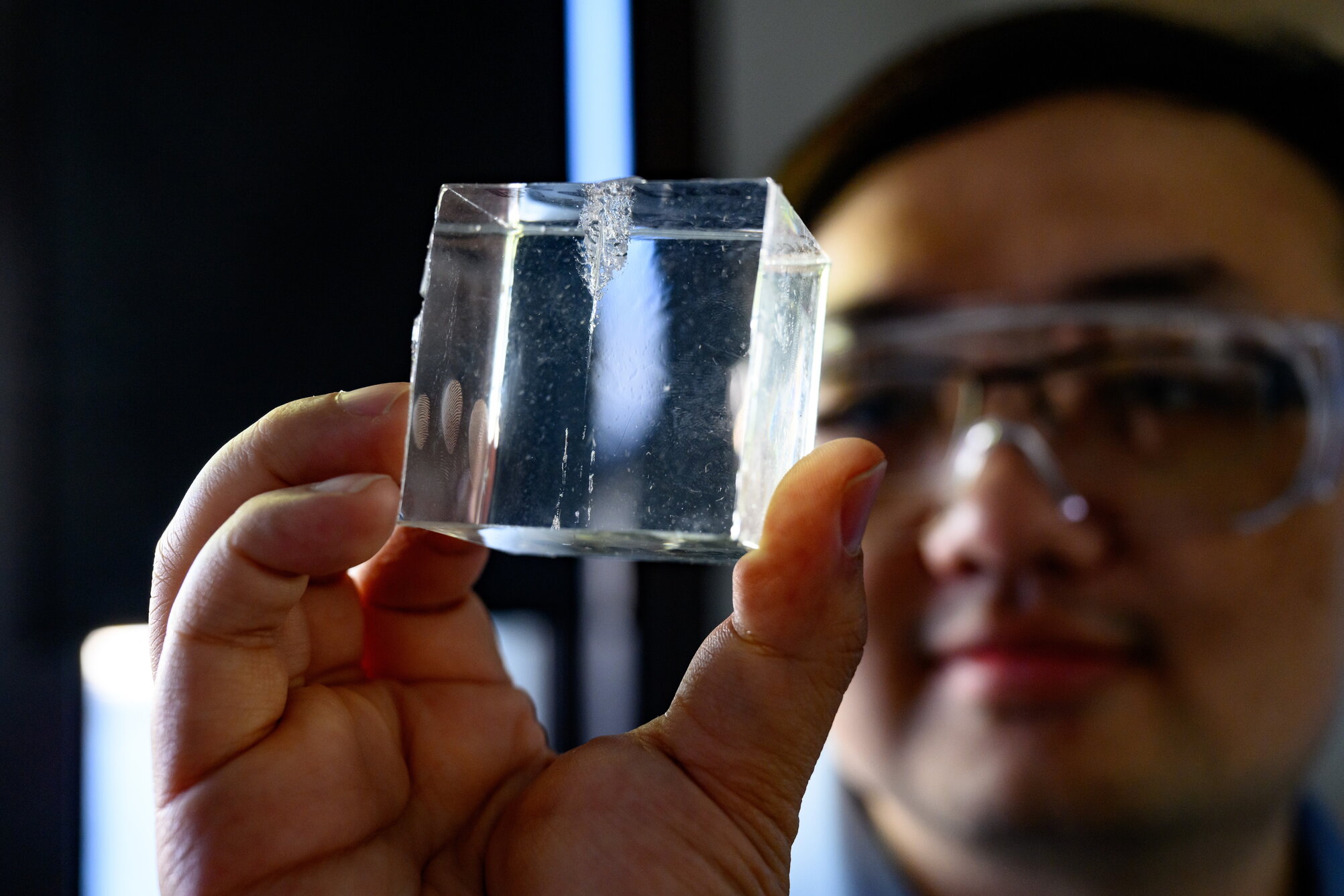 A man looking at a synthetic gel