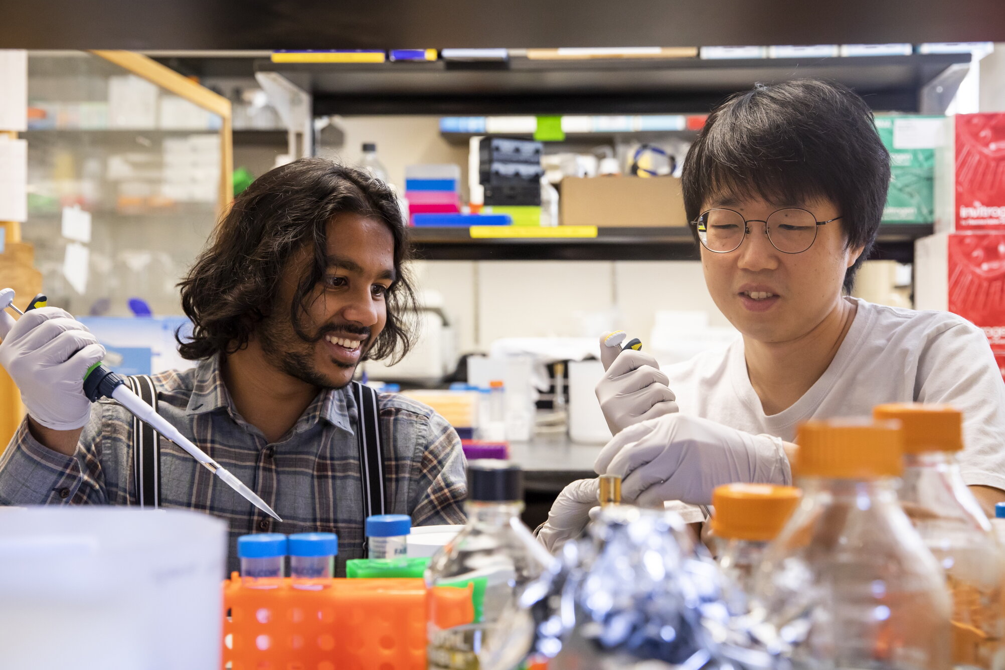 Two students working in a lab