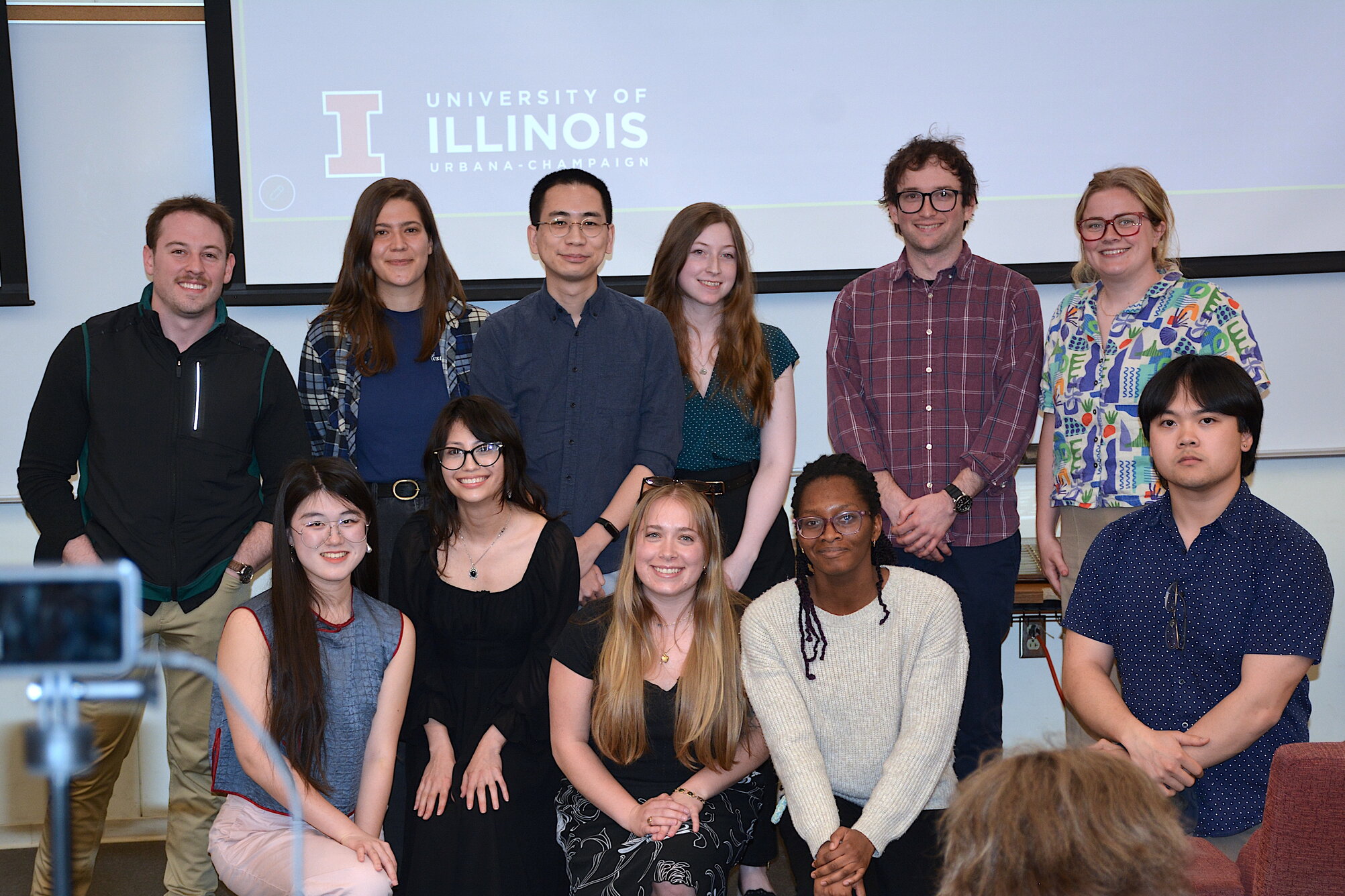 A group of students smiling at a camera 