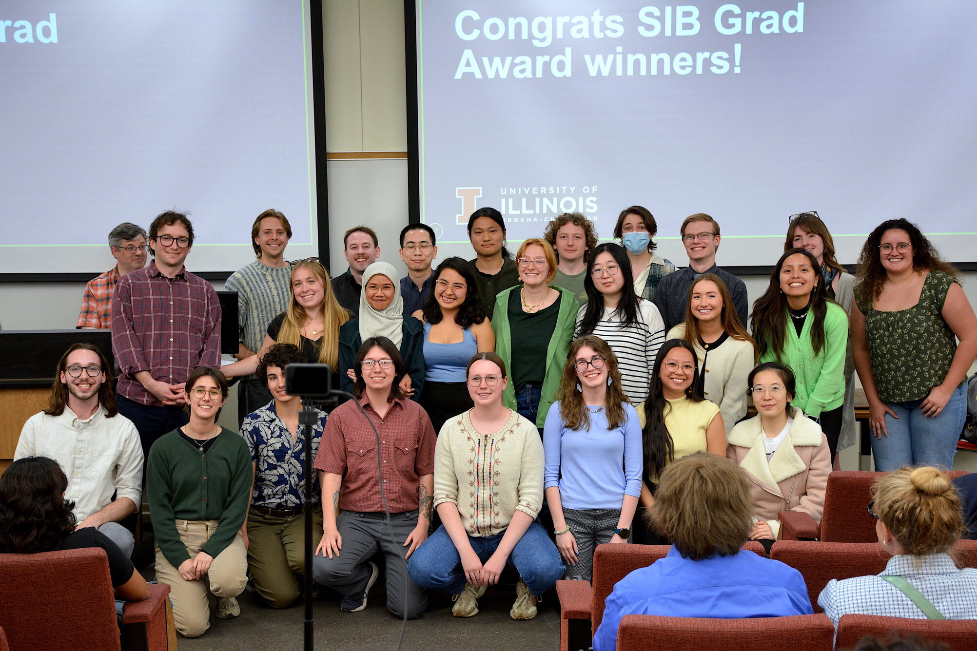 A group of students smiling at a camera