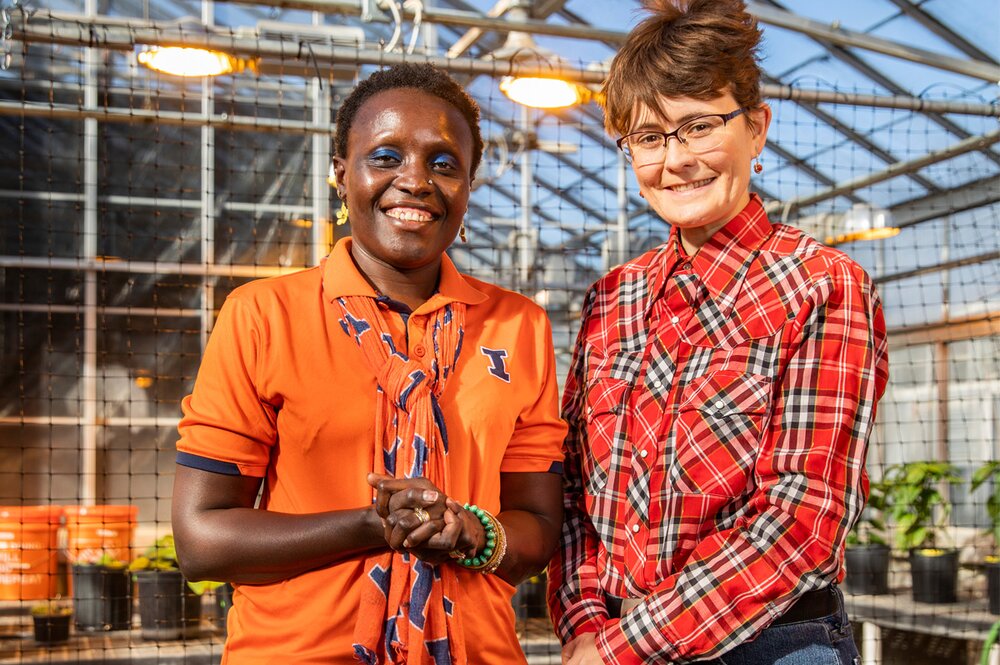 Esther Ngumbi and Erinn Dady in greenhouse