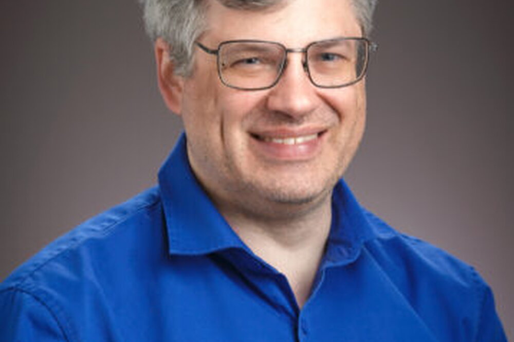 A headshot of Phil Anderson