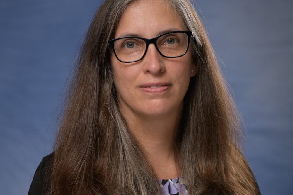 headshot of Carla Caceres