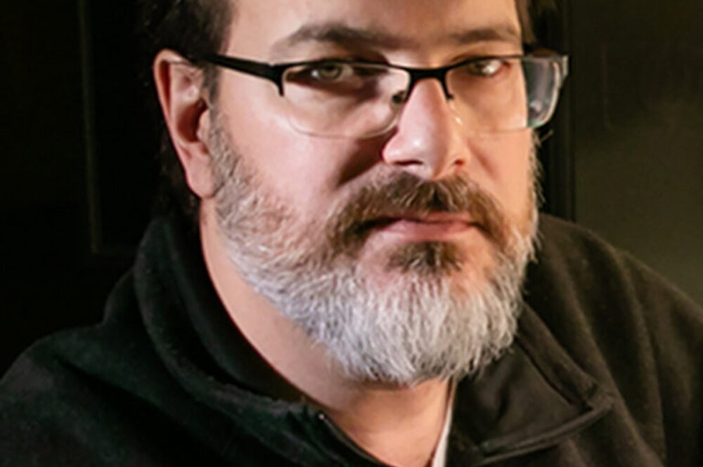 A headshot of Andy Suarez