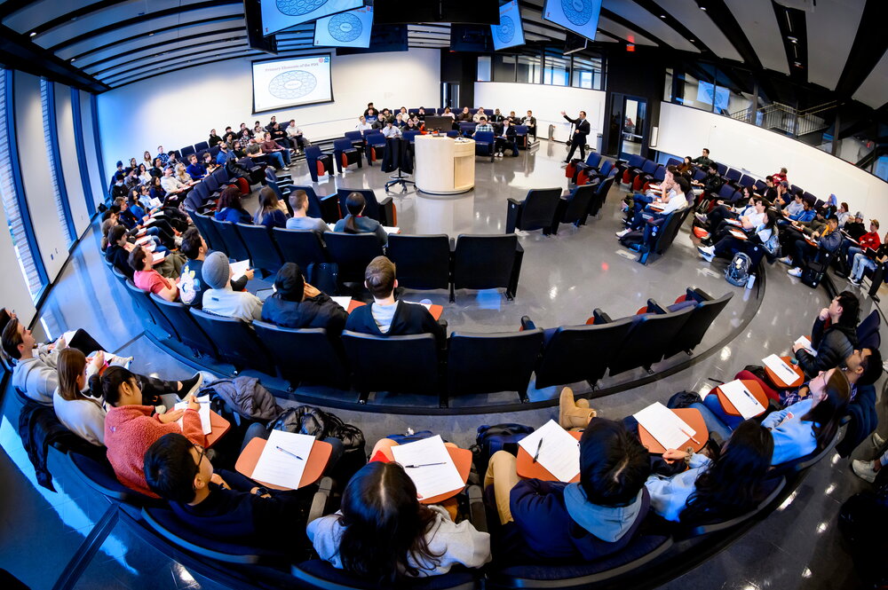 aerial view of people sitting in chairs in a circle