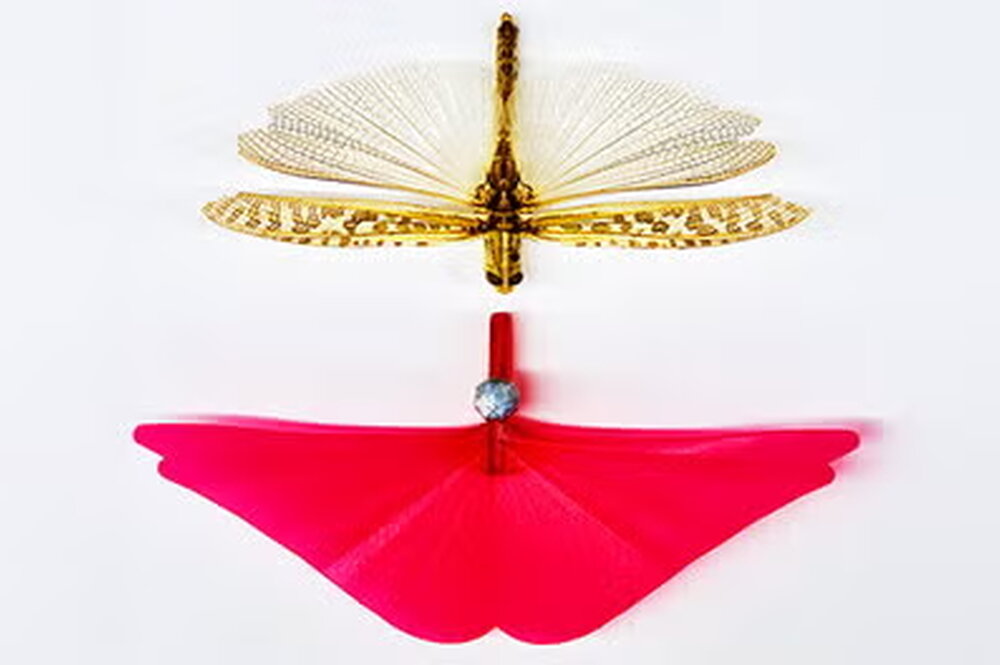 A grasshopper next to a red 3d model