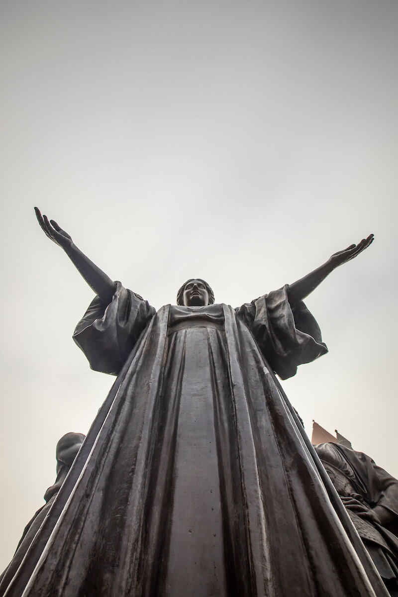 Alma mater statue.