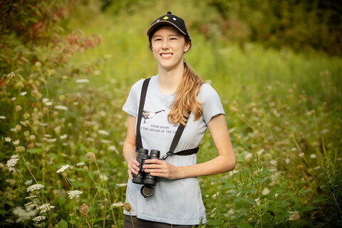 smiling woman with binoculars