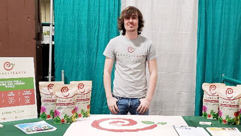 man standing behind a presentation