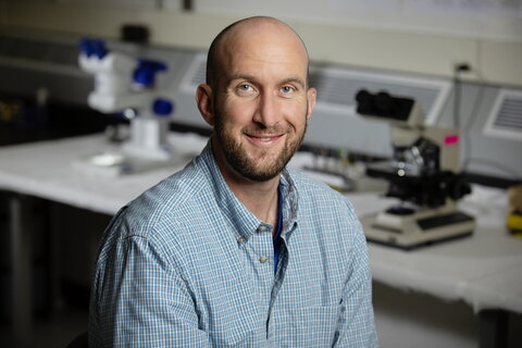 smiling man in a lab