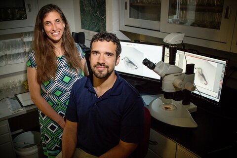 two smiling people in a lab