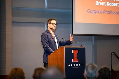 Brent Roberts speaking at a podium