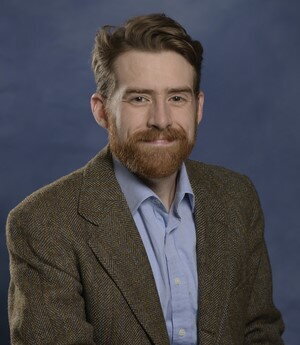 A headshot of Adam Dolezal