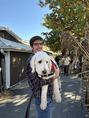 Matt Holding Large White Dog