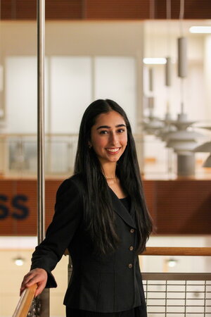 A smiling woman standing in an office