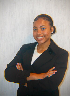 A smiling woman in a suit