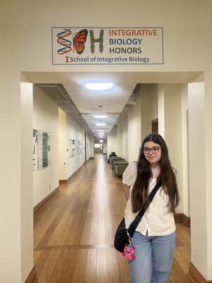 girl standing in hallway of IB Honors 