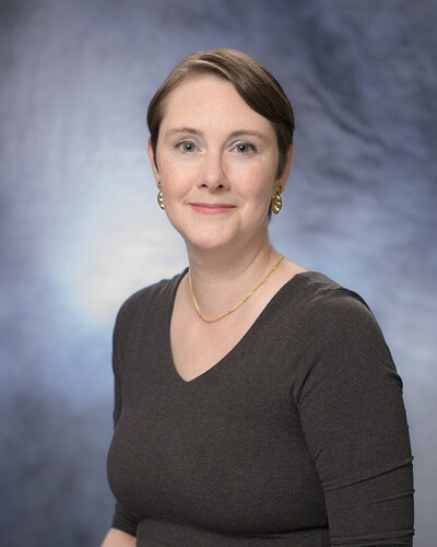 A professional headshot of Amy Marshall-Colon