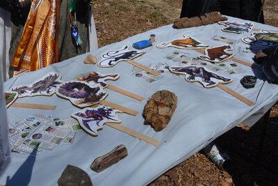 D&D monsters on a stick on a clothed table.