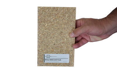 A hand holding a notebook