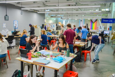 A room full of students working on projects
