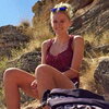 woman sitting in a rocky area