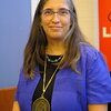 photo of smiling woman with medal