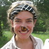 a butterfly on a person's nose