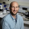 smiling man in a lab