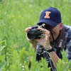 happy man taking a photo in a field