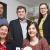 five smiling people