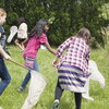children in a field with nets