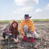 A man and a woman working in a field together