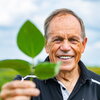 A photo of Stephen Long holding a plant