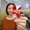 A photo of Minya holding a flower