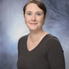 A professional headshot of Amy Marshall-Colon