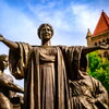 A statue with a blue sky in the backgrounds