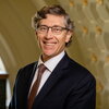 A smiling man in a suit
