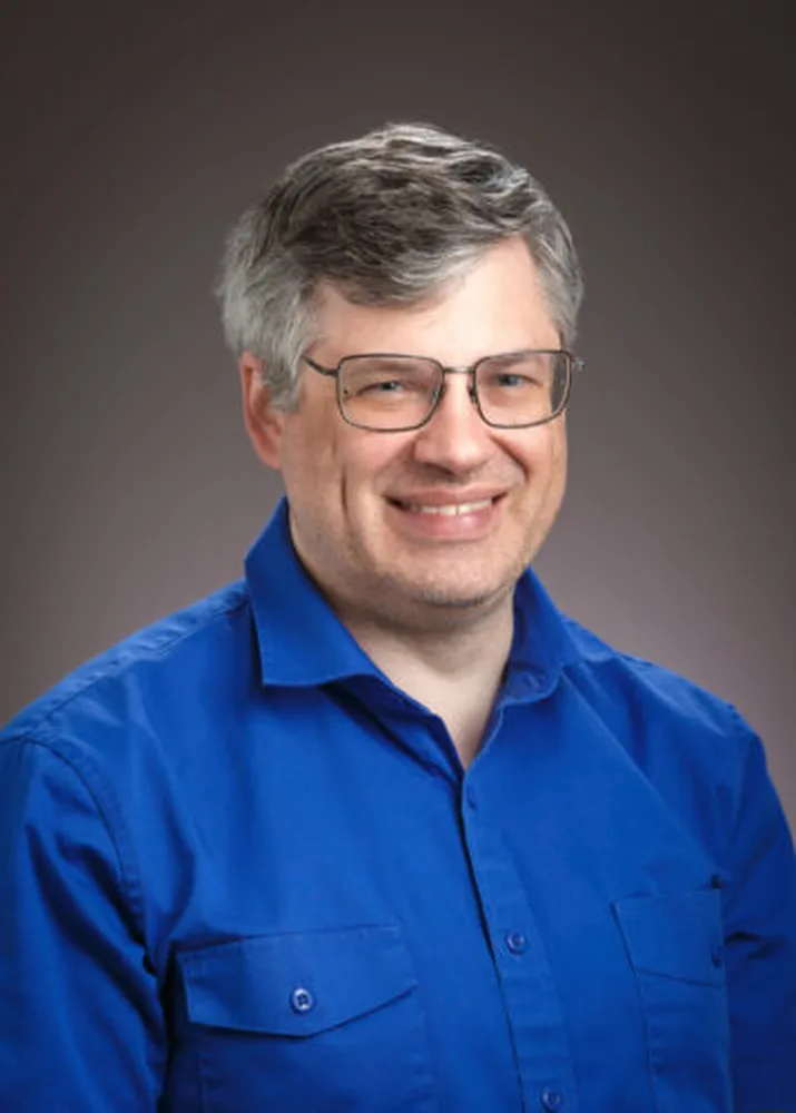 A headshot of Phil Anderson
