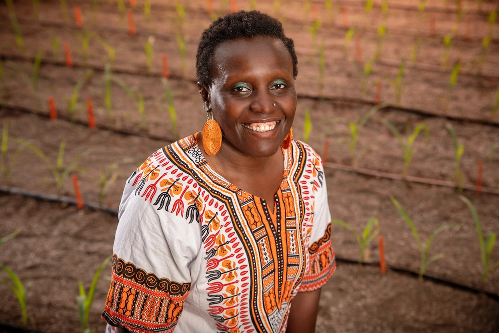 A photo of Esther standing in a field