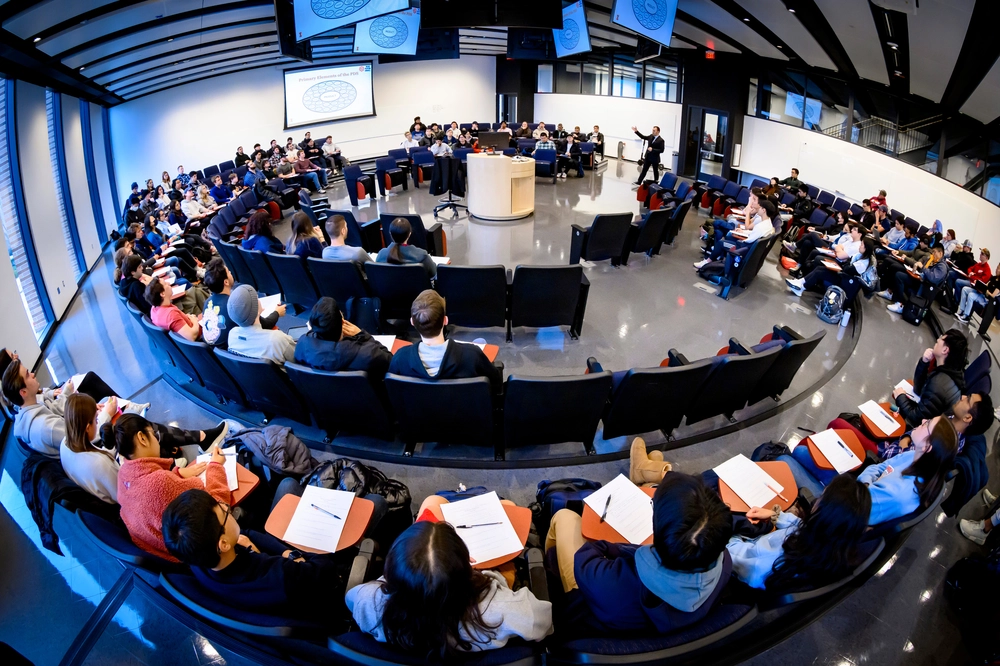 aerial view of people sitting in chairs in a circle